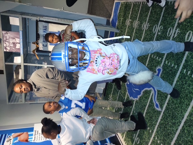 students posing in Lions gear